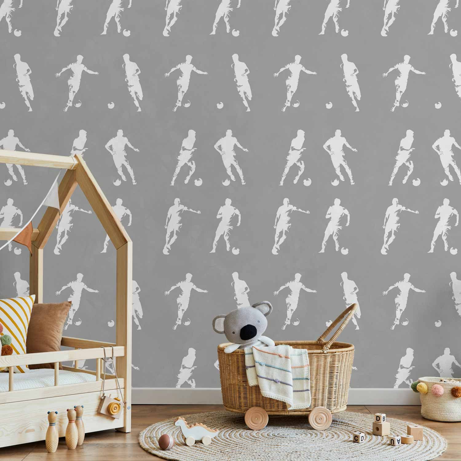 Wallpaper Sportowe Sylwetki - Dynamiczne figury piłkarzy na szarym tle 50×1000 cm, standard non-woven